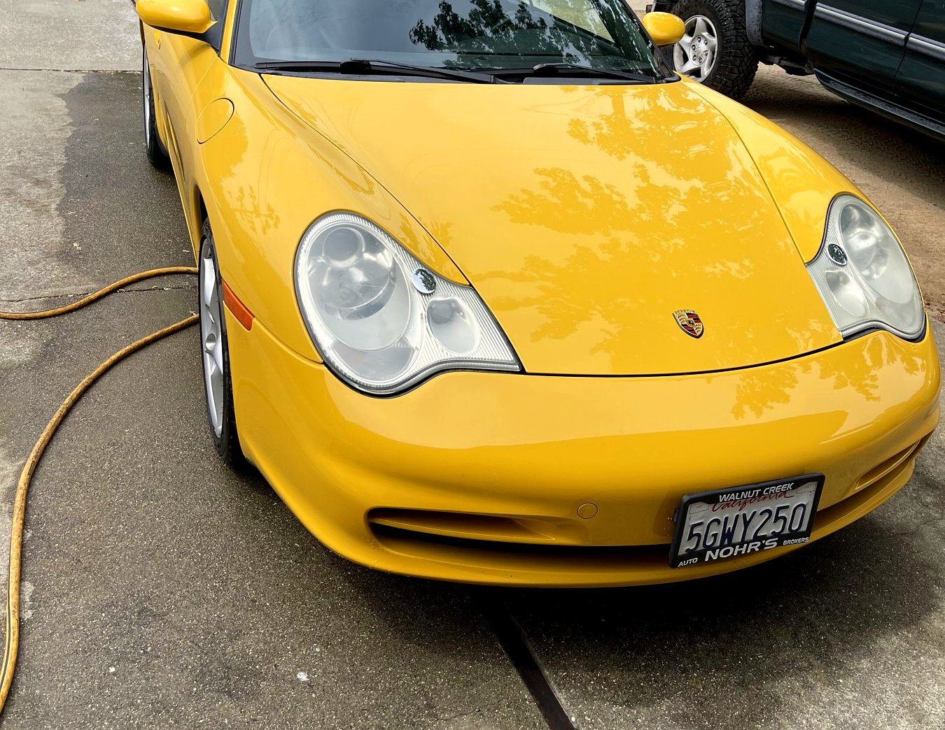 Yellow Porsche 911 convertible after a full detail